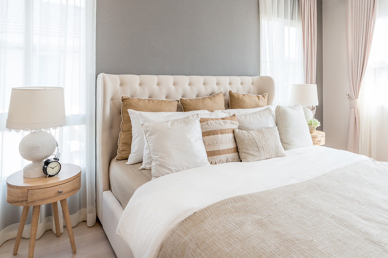 bedroom with night lamp above bedside table